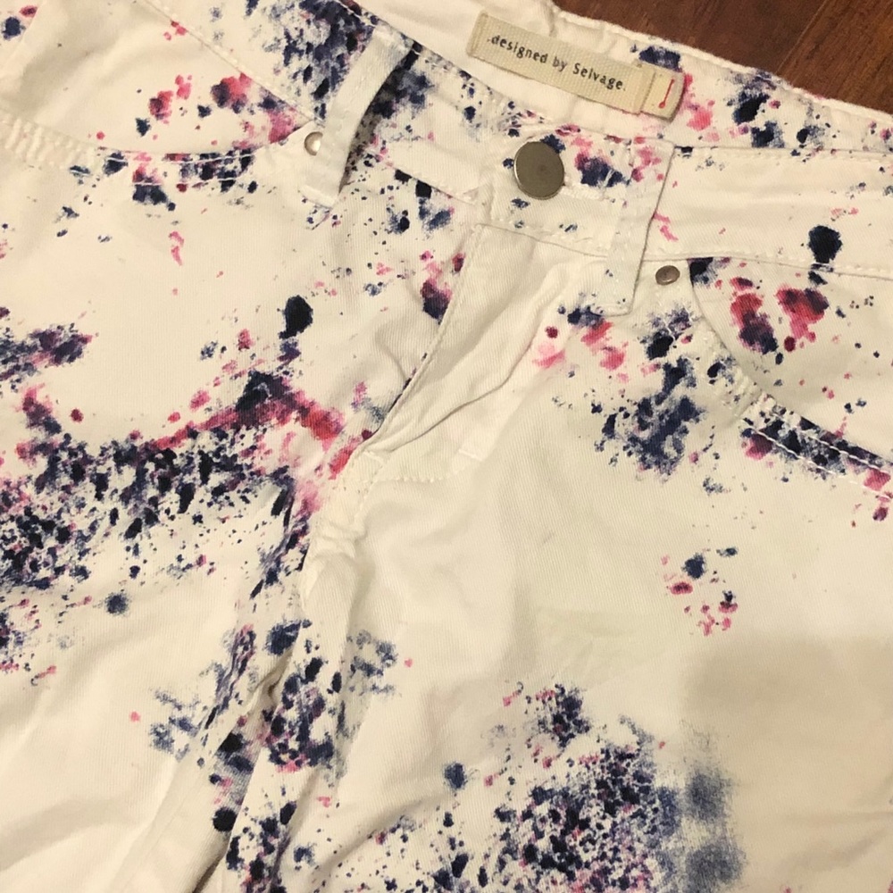 Paint splattered white pants
